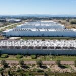 Hillsboro, OR, USA, Aerial drone picture of QTS Hillsboro data center buildings with rooftop HVAC cooling units and surrounding industrial area infrastructure