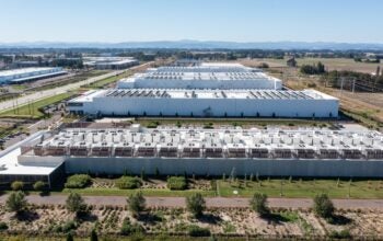 Hillsboro, OR, USA, Aerial drone picture of QTS Hillsboro data center buildings with rooftop HVAC cooling units and surrounding industrial area infrastructure