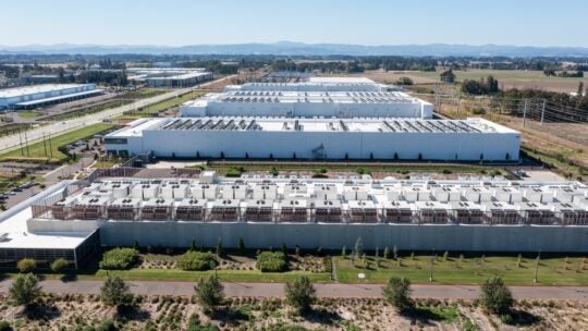 Hillsboro, OR, USA, Aerial drone picture of QTS Hillsboro data center buildings with rooftop HVAC cooling units and surrounding industrial area infrastructure