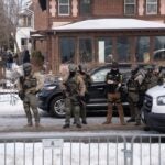 Minneapolis, Minnesota, United States. Law enforcement officers at the crime scene after ICE agent shots civilian Renee Good.