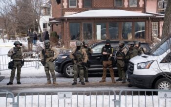 Minneapolis, Minnesota, United States. Law enforcement officers at the crime scene after ICE agent shots civilian Renee Good.