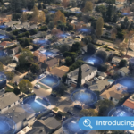 Ring Search Party Super Bowl ad shows blue halos highlighting all the houses in a neighborhood, symbolizing connection.