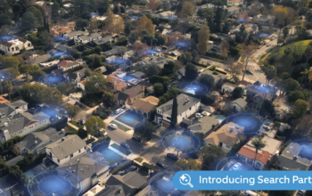 Ring Search Party Super Bowl ad shows blue halos highlighting all the houses in a neighborhood, symbolizing connection.