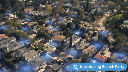 Ring Search Party Super Bowl ad shows blue halos highlighting all the houses in a neighborhood, symbolizing connection.