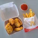 McDonald's Regular French Fries And Chicken McNuggets With Sauce.