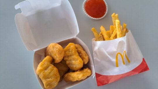 McDonald's Regular French Fries And Chicken McNuggets With Sauce.