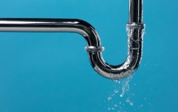 Leaking water from stainless steel pipe under sink in reference to leaks of information to the media and public.