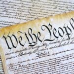 A parchment of the first Constitution of the United States close up. The Bill of Rights as a focus in regards to journalist subpoena by the Department of Justice