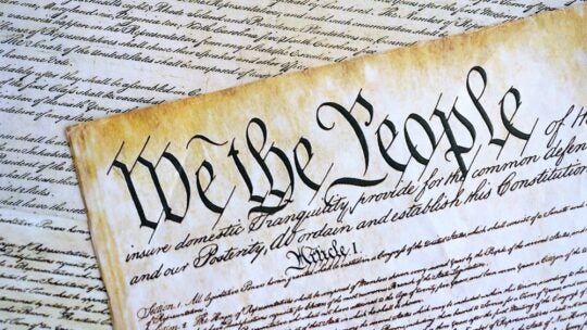 A parchment of the first Constitution of the United States close up. The Bill of Rights as a focus in regards to journalist subpoena by the Department of Justice