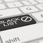 a white keyboard with black blacklist button, signifying journalists blacklisting certain PR people