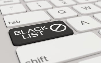 a white keyboard with black blacklist button, signifying journalists blacklisting certain PR people