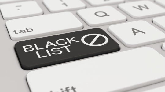 a white keyboard with black blacklist button, signifying journalists blacklisting certain PR people