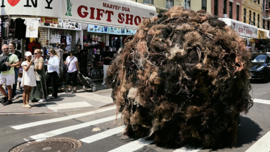 PR Roundup features a debate on the Claude watermark and a giant hairball rolling through NYC as an experiential activation for k18 haircare
