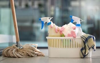 Everything you need to get your AI squeaky clean. Shot of cleaning products on the floor at home.