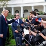 President Donald Trump addressing press before boarding Marine One on the South Lawn of the White House. White House press pool media reporters