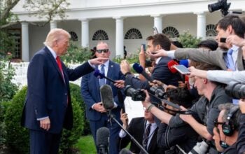President Donald Trump addressing press before boarding Marine One on the South Lawn of the White House. White House press pool media reporters