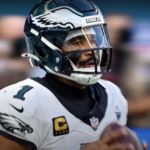 Jalen Hurts of the Philadelphia Eagles playing football in his uniform