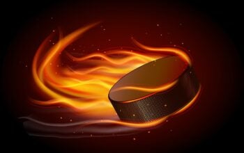 Realistic ice hockey puck in fire on black background